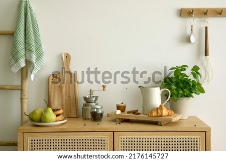 Interior design of kitchen space with rattan commode,  ladder, pears, food and kitchen accessories in modern home decor.  Template.