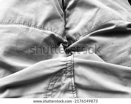 a gray fabric with seams