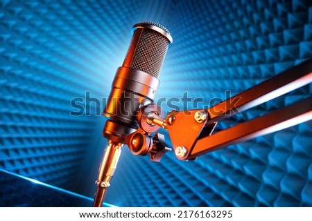 microphone and microphone boom stand in recording studio.