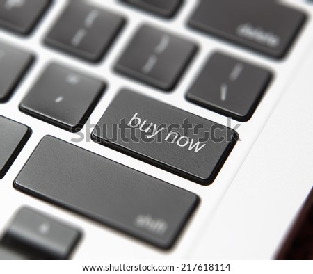 Computer keyboard with "buy now" button