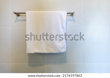 Closeup towel hanging on clothesline in the bathroom with space for texts