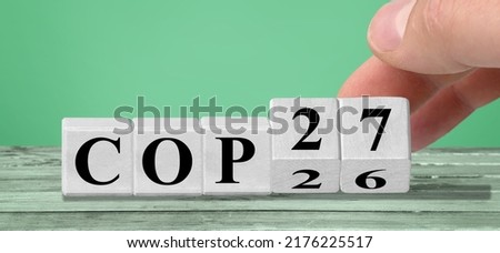 Symbol for change. Hand turns dice and changes the expression Royalty-Free Stock Photo #2176225517