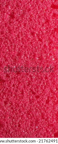 close-up, background, texture, large long vertical banner. heterogeneous surface fine pore structure bright saturated red pumice stone for finger care. full depth of field. high resolution photo