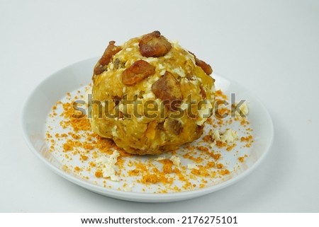 Bolon stuffed with cheese and pork rinds accompanied by a traditional coffee Royalty-Free Stock Photo #2176275101
