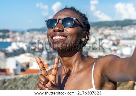 young lady taking a selfie on a hot day