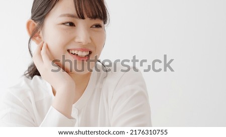 Asian woman relaxing in the living room