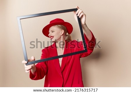 portrait of a woman red lips fashion jacket frame beige background