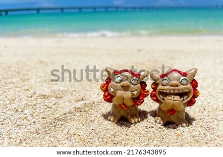 Shisa figurine and background material Okinawa Royalty-Free Stock Photo #2176343895