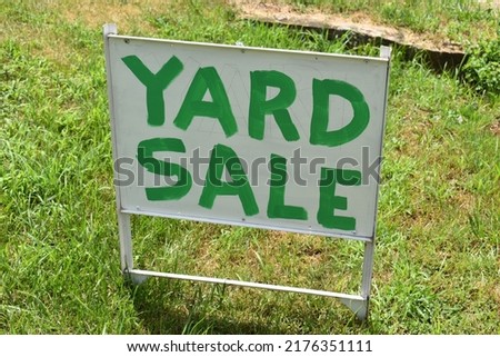 Yard sale sign in a yard