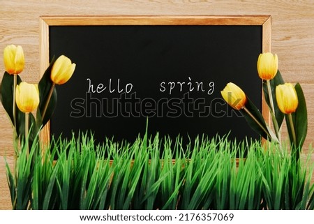 Blackboard with hello spring written