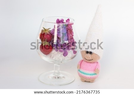 A little gnome knitted with knitting needles. Gift for children holiday card