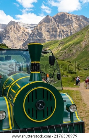 Detail of the mountain train towards Panticosa from the Ripera valley with tourists, Pyrenees