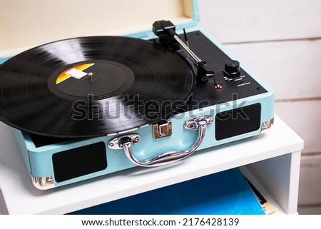 Analog vinyl record player with disc. Modern turntable audio equipment, close up.