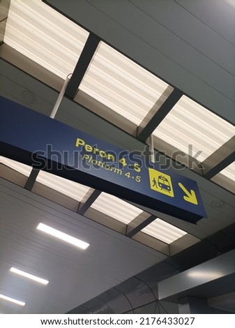 "Peron" comes from Indonesian which means "Platform" in English. The function of platform sign to shows the train line that we will ride. 