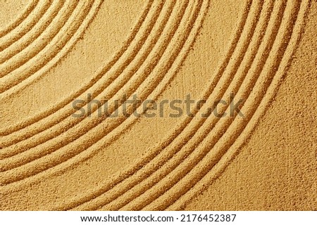 Texture yellow sand summer day and smooth lines for relaxation and meditation.