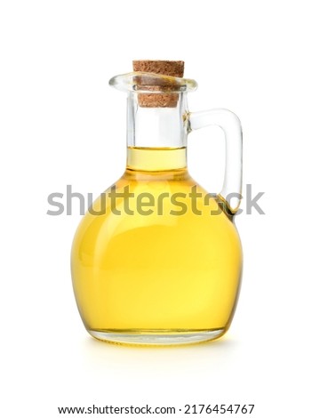Bottle of cooking oil with cork cap isolated on white background. Clipping path. Royalty-Free Stock Photo #2176454767