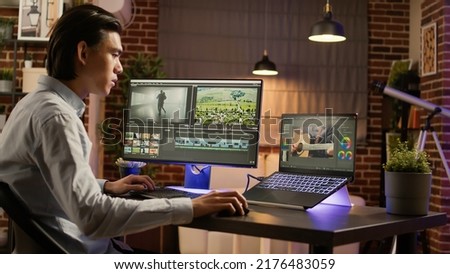 Graphic designer working on editing footage software to edit video montage with color gradient and visual effects. Sound and film production design, creating digital movie on app. .