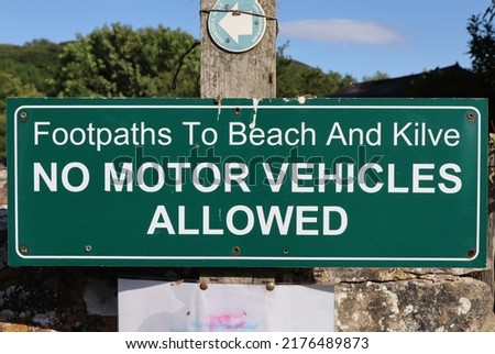 A sign at the start of the footpath to Kilve beach in Somerset, warning that no motor vehicles must pass this point