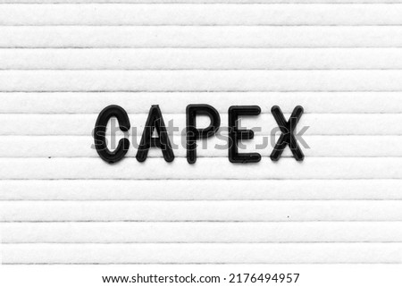 Black color letter in word CAPEX (Abbreviation of Capital Expenditure) on white felt board background