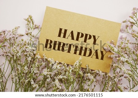 Happy Birthday text message with flower decoration blue background