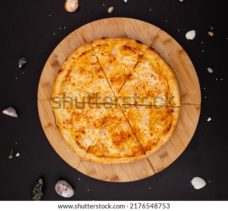 pizza on a black background with decorations