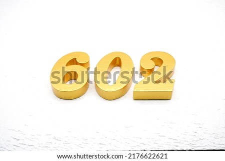       Number 602 is made of gold painted teak, 1 cm thick, laid on a white painted aerated brick floor, visualized in 3D.                                                 