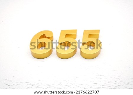      Number 655 is made of gold painted teak, 1 cm thick, laid on a white painted aerated brick floor, visualized in 3D.                                         
