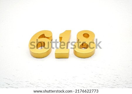   Number 618 is made of gold painted teak, 1 cm thick, laid on a white painted aerated brick floor, visualized in 3D.                                                   