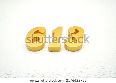   Number 613 is made of gold painted teak, 1 cm thick, laid on a white painted aerated brick floor, visualized in 3D.                                          