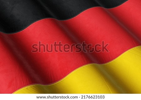 Germany Flag Waving in the Wind on Flagpole, on sky background