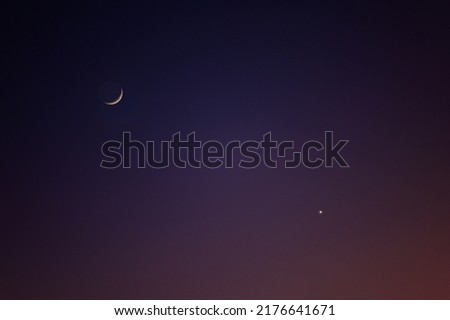 clear twilight sunset sky with crescent moon and venus 
