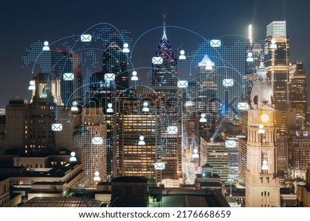 Aerial panoramic cityscape of Philadelphia financial downtown at night time, Pennsylvania, USA. Glowing Social media icons. The concept of networking and establishing new connections between people