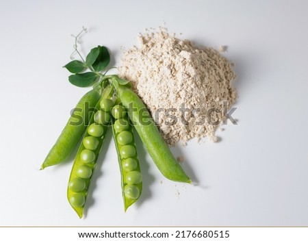 Top view fresh green peas with protein power from green peas, plant base protein concept, isolated on white background. Royalty-Free Stock Photo #2176680515