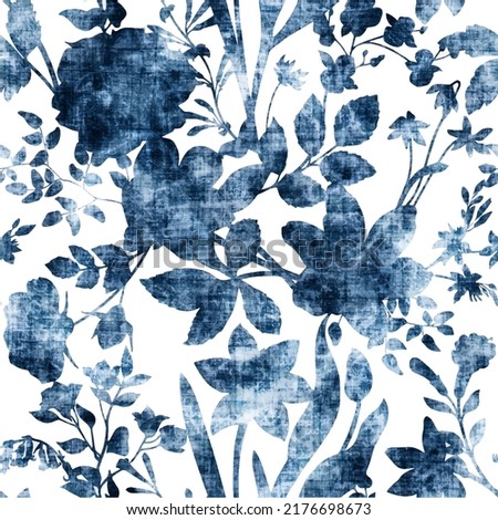 Floral decorative seamless pattern,  Denim floral wallpaper. Blue Jeans background with flowers, leaves and branches. vector grunge texture. Royalty-Free Stock Photo #2176698673