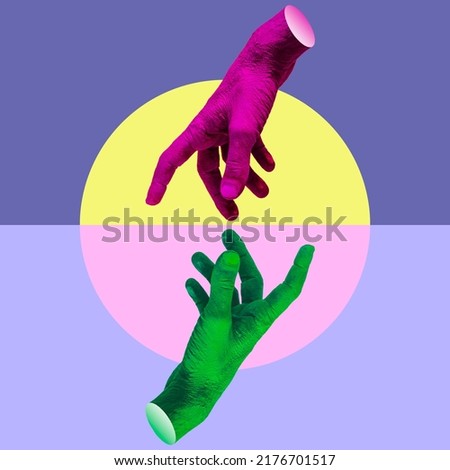 Two painted pink and green hands try to reach each other's fingers. Creative connecting conception. Collage art. Royalty-Free Stock Photo #2176701517