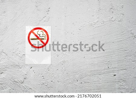 Label no smoking metal sign on Stone texture  background