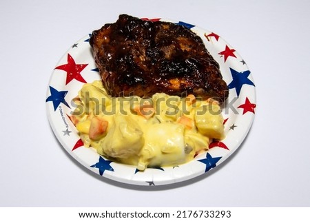 barbecue pork ribs and potato salad 