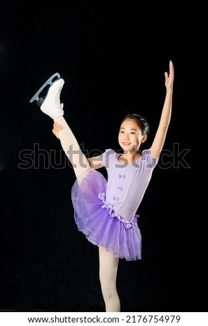 Asian girl performing figure skate. Figure skater.
