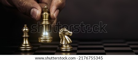 Hand choose king chess fight concept of challenge or team player or business team and leadership strategy or strategic planning and human resources organization risk management. Royalty-Free Stock Photo #2176755345