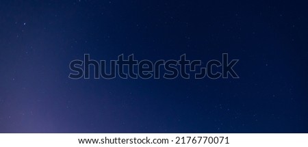 Stars in the sky.
Blue night panorama, milky way sky and stars on dark background, universe full of stars, nebula and galaxies.