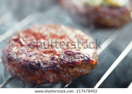 food meat - burgers on bbq barbecue grill Shallow dof.