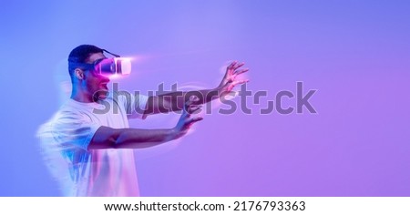 Modern Technologies For Entertainment, collage. Amazed black man in VR headset experiencing virtual reality while playing video game, standing in vivid neon light over purple background, copy space
