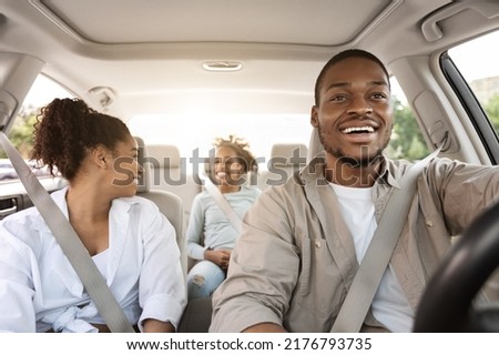 Car Ownership. Happy Black Parents And Daughter Sitting In Auto During Road Trip In Summer. Family Traveling By Automobile. Vehicle Purchase And Leasing. Selective Focus Royalty-Free Stock Photo #2176793735