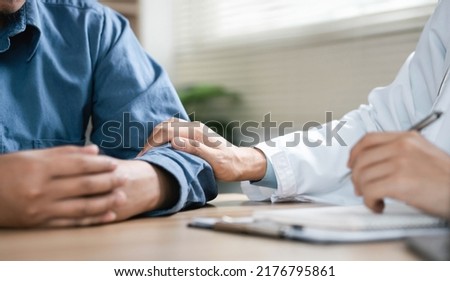 The psychiatrist talks to the patient about the bad news. The patient has a serious illness that has no cure. Desperate, bad news, discouraged. Royalty-Free Stock Photo #2176795861