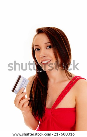 A smiling Asian woman in a red dress holding her credit card, ready for shopping, isolated for white background. 