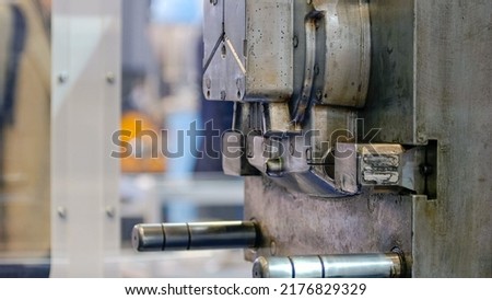 Close-up of large industrial metal factory machine motion. Moving back and forth.