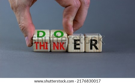 Doer or thinker symbol. Concept words Doer or thinker on wooden cubes. Businessman hand. Beautiful grey table grey background. Business and doer or thinker concept. Copy space. Royalty-Free Stock Photo #2176830017