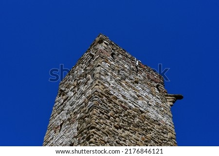 An old tower at Umbria against blue sky