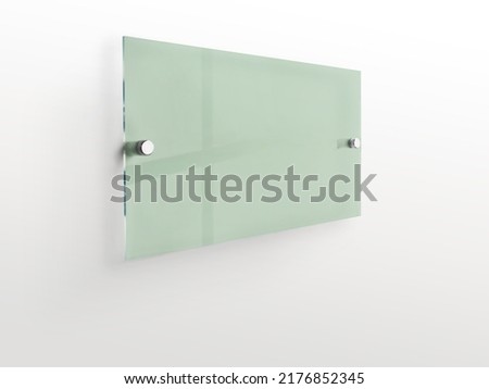 Gren rectangle transparent glass nameplate plate on spacer metal holders. Clear printing board for branding. Acrilic reseda advertising signboard on white background mock-up side view. 