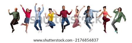Group of joyful multicultural young people jumping over white background, full length shot of diverse happy carefree multiethnic men and women having fun, expressing positive emotions, panorama